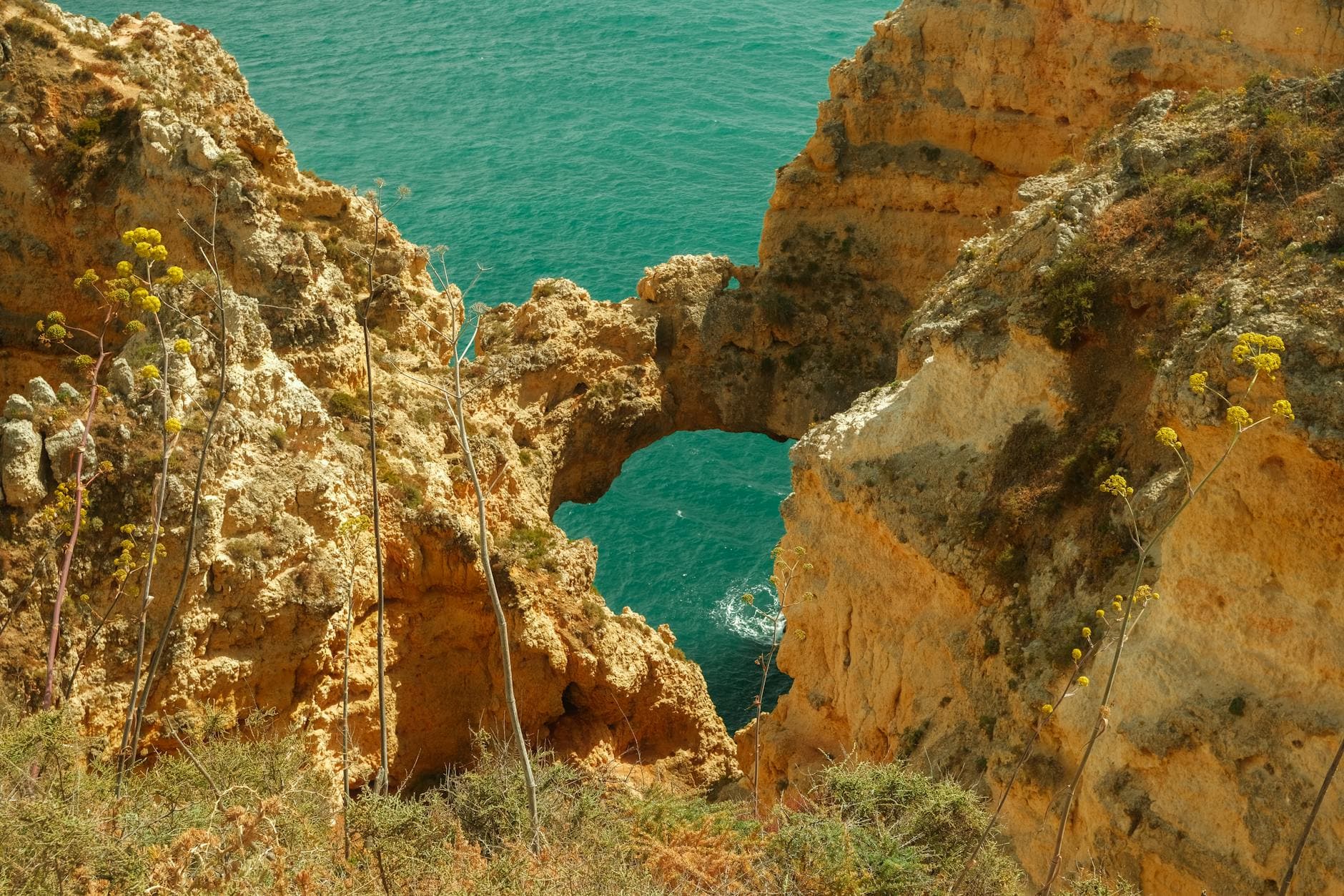 Explore the dramatic rock formations of Ponta da Piedade in Lagos, Portugal, a summer travel destination.